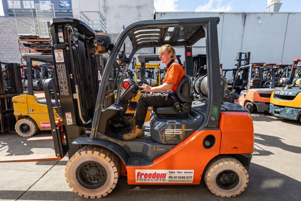 Photo of staff member on a forklift